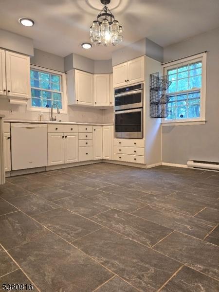 103 Mountain Top Rd, Lebanon Twp, NJ 08826 - kitchen with white dishwasher, double oven, white cabinetry, healthy amount of natural light, and recessed lighting