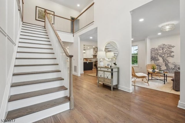 48 Lewis Ave, Summit City, NJ 07901 - staircase featuring wood finished floors, recessed lighting, a towering ceiling, and baseboards