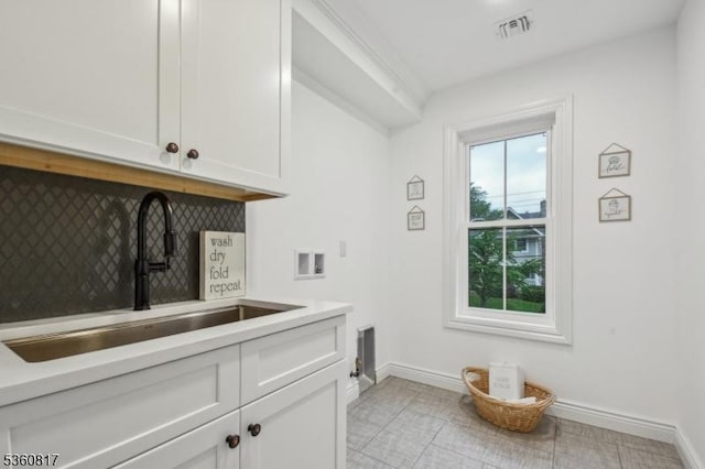 48 Lewis Ave, Summit City, NJ 07901 - laundry room with cabinet space, hookup for a washing machine, baseboards, electric dryer hookup, and light tile patterned floors