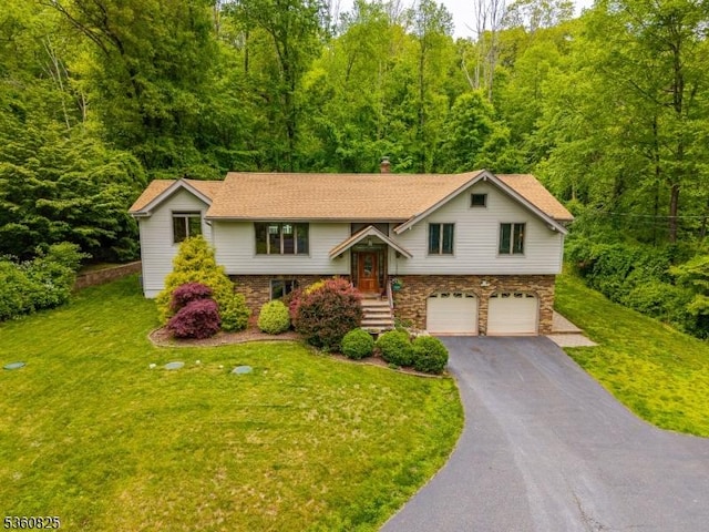 542 Drakestown Rd, Mount Olive Twp, NJ 07836 - bi-level home with driveway, a garage, a front yard, a chimney, and a wooded view