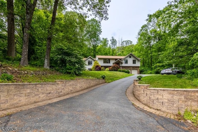 542 Drakestown Rd, Mount Olive Twp, NJ 07836 - bi-level home with an attached garage, driveway, and a front lawn