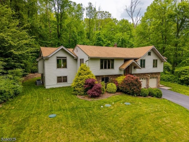 542 Drakestown Rd, Mount Olive Twp, NJ 07836 - split foyer home with driveway, an attached garage, a chimney, and a front yard