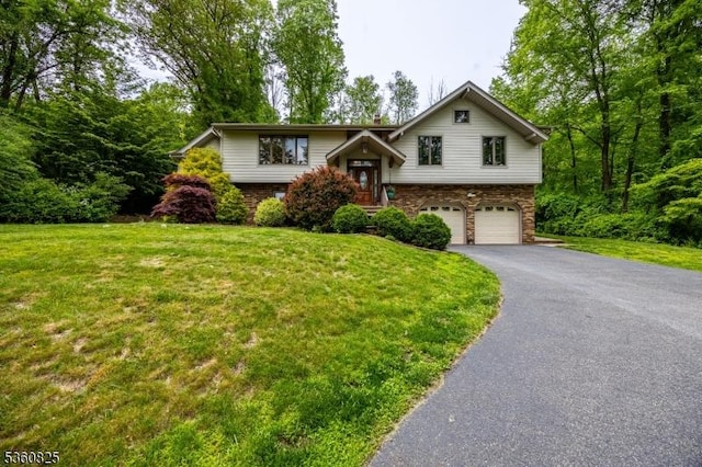 542 Drakestown Rd, Mount Olive Twp, NJ 07836 - raised ranch with an attached garage, asphalt driveway, and a front yard