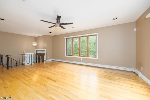 542 Drakestown Rd, Mount Olive Twp, NJ 07836 - empty room with wood finished floors, a ceiling fan, baseboards, a baseboard heating unit, and recessed lighting