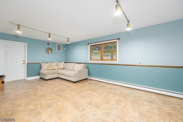 542 Drakestown Rd, Mount Olive Twp, NJ 07836 - living room featuring track lighting, a baseboard heating unit, and baseboards