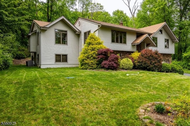 542 Drakestown Rd, Mount Olive Twp, NJ 07836 - view of front of home with a chimney, a front lawn, central AC unit, and an attached garage
