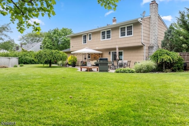 39 Fox Chase Run, Hillsborough Twp, NJ 08844 - rear view of house with a chimney and a patio area