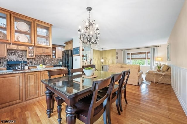 39 Fox Chase Run, Hillsborough Twp, NJ 08844 - dining area featuring a chandelier, light wood finished floors, and a wainscoted wall