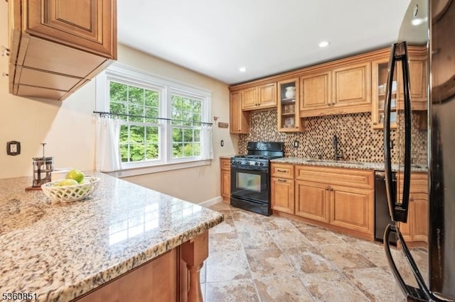 39 Fox Chase Run, Hillsborough Twp, NJ 08844 - kitchen featuring black appliances, decorative backsplash, a sink, light stone counters, and glass insert cabinets