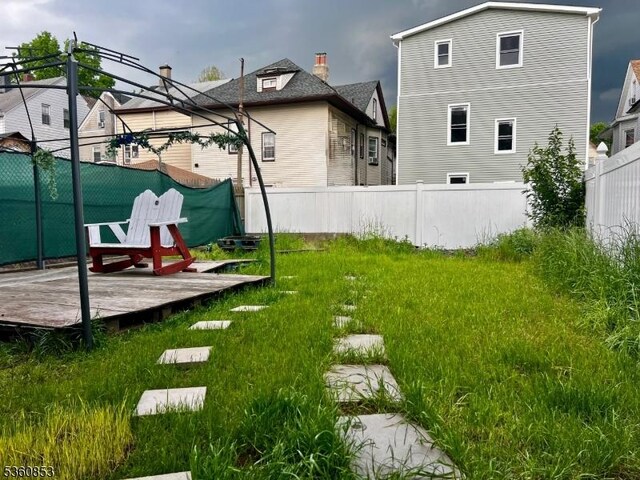 654 E 26th St, Paterson City, NJ 07504 - view of yard featuring a wooden deck