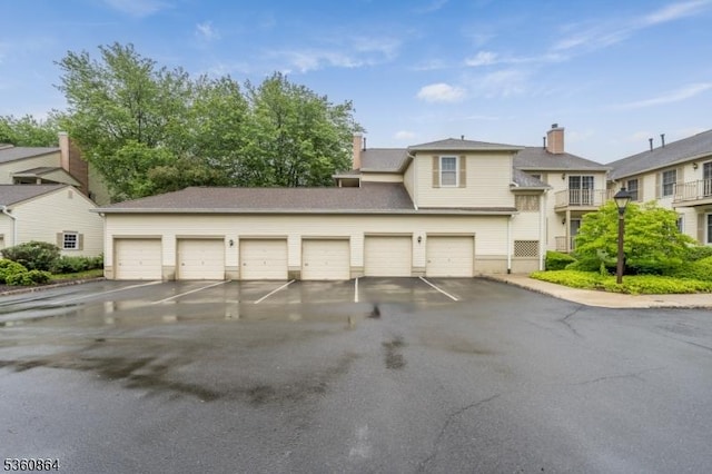 48 Jamestown Rd, Bernards Twp, NJ 07920 - view of front of house with community garages and a chimney