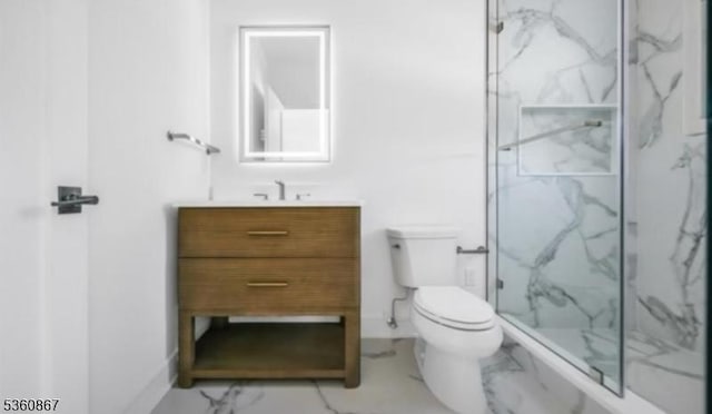 15 Scott Ter, Clifton City, NJ 07013 - bathroom featuring marble look tile flooring, toilet, a marble finish shower, vanity, and baseboards