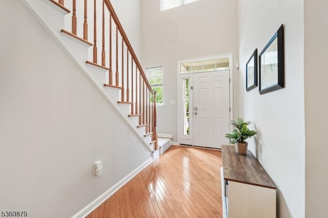 25 Kennedy Ct, Montgomery Twp, NJ 08540 - foyer with light wood-style floors, stairs, baseboards, and a high ceiling
