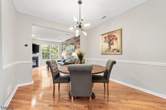 25 Kennedy Ct, Montgomery Twp, NJ 08540 - dining space featuring a chandelier, light wood-style flooring, and baseboards