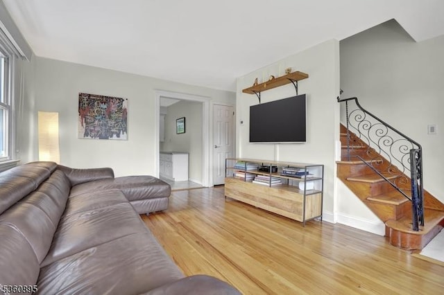 51 Hoffman Ave, Parsippany-Troy Hills Twp, NJ 07034 - living room featuring light wood-style floors, stairs, and baseboards