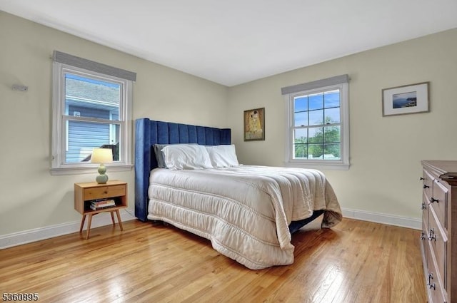 51 Hoffman Ave, Parsippany-Troy Hills Twp, NJ 07034 - bedroom with multiple windows, light wood-style floors, and baseboards