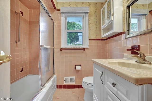 51 Hoffman Ave, Parsippany-Troy Hills Twp, NJ 07034 - full bath featuring vanity, toilet, wallpapered walls, bath / shower combo with glass door, and tile walls