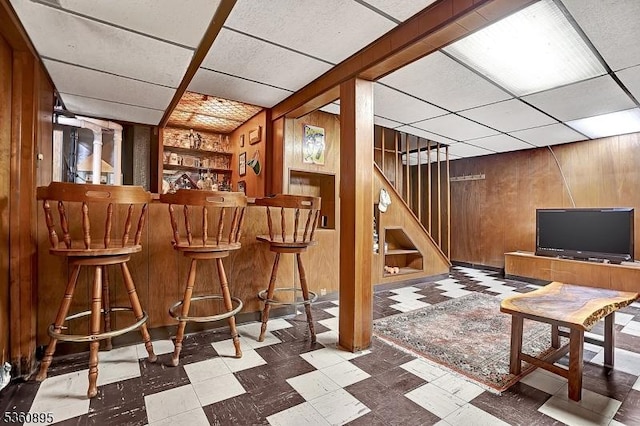 51 Hoffman Ave, Parsippany-Troy Hills Twp, NJ 07034 - indoor dry bar with tile patterned floors, wood walls, stairway, built in features, and a drop ceiling