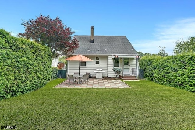 51 Hoffman Ave, Parsippany-Troy Hills Twp, NJ 07034 - rear view of property with a patio area, a lawn, and a chimney