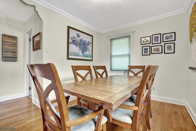 51 Hoffman Ave, Parsippany-Troy Hills Twp, NJ 07034 - dining room with light wood finished floors, baseboards, and crown molding