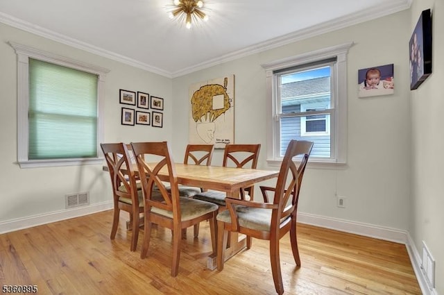 51 Hoffman Ave, Parsippany-Troy Hills Twp, NJ 07034 - dining area with light wood-style floors, ornamental molding, and baseboards