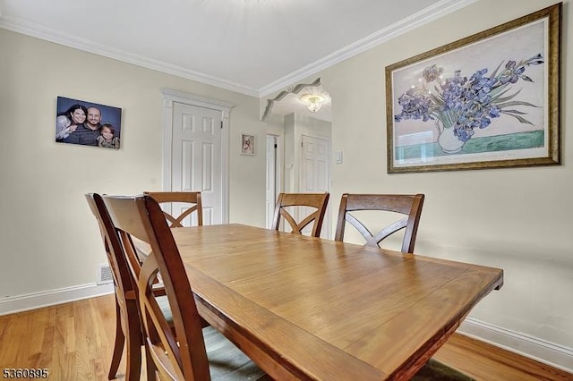 51 Hoffman Ave, Parsippany-Troy Hills Twp, NJ 07034 - dining room with baseboards, wood finished floors, and ornamental molding