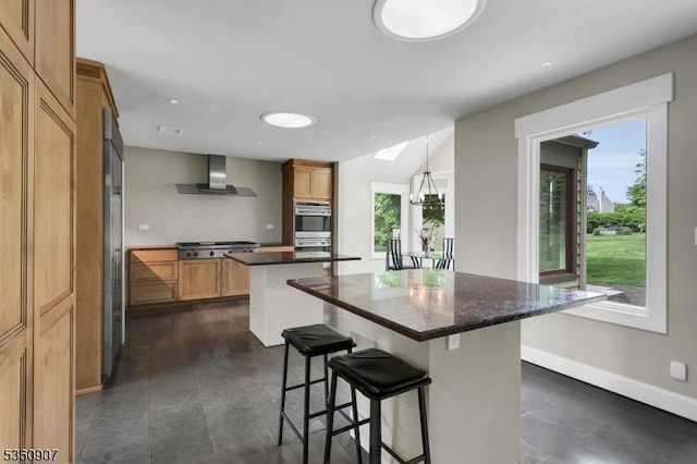 34 Keats Rd, Bernards Twp, NJ 07920 - kitchen featuring wall chimney range hood, a kitchen island, stainless steel appliances, a breakfast bar area, and baseboards