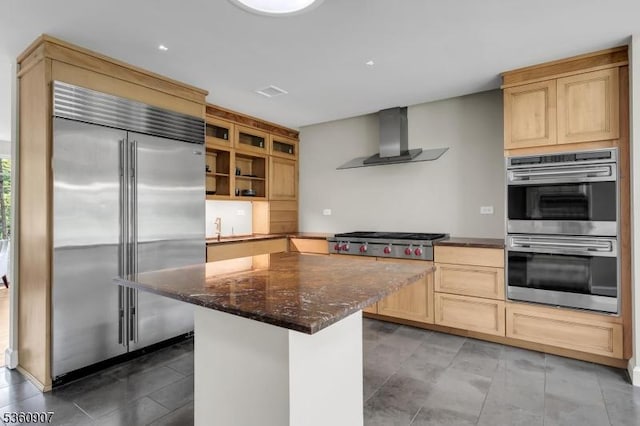 34 Keats Rd, Bernards Twp, NJ 07920 - kitchen with stainless steel appliances, wall chimney range hood, light brown cabinets, a center island, and dark stone counters