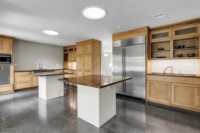 34 Keats Rd, Bernards Twp, NJ 07920 - kitchen featuring built in appliances, a kitchen island, open shelves, a kitchen breakfast bar, and glass insert cabinets