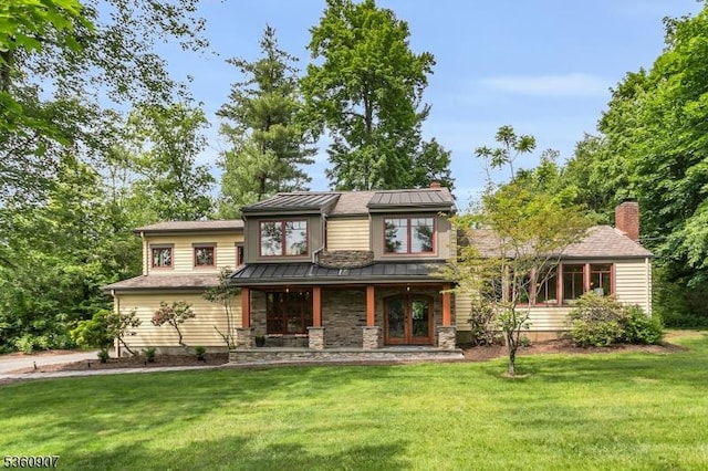 34 Keats Rd, Bernards Twp, NJ 07920 - view of front of house featuring a standing seam roof, a front yard, a porch, and metal roof