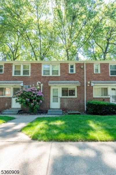 230 Lafayette Pl Unit 2B, Englewood City, NJ 07631 - townhome / multi-family property with entry steps, brick siding, and a front yard