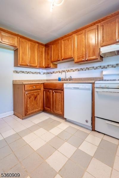 230 Lafayette Pl Unit 2B, Englewood City, NJ 07631 - kitchen featuring white appliances, under cabinet range hood, and tasteful backsplash