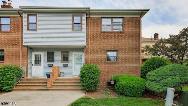 1106 Tudor Ct, Hillsborough Twp, NJ 08844 - view of front facade featuring brick siding