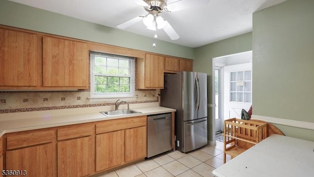 1106 Tudor Ct, Hillsborough Twp, NJ 08844 - kitchen with stainless steel appliances, a sink, light countertops, and light tile patterned floors
