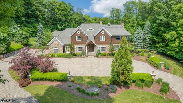 10 Van Kirk Pl, Sparta Twp, NJ 07871 - shingle-style home with stone siding and a chimney