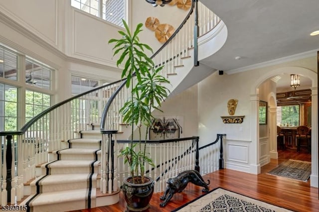10 Van Kirk Pl, Sparta Twp, NJ 07871 - staircase with wood finished floors, arched walkways, plenty of natural light, ornate columns, and a high ceiling