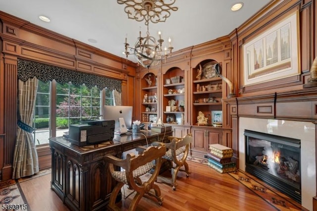 10 Van Kirk Pl, Sparta Twp, NJ 07871 - office area with a chandelier, built in shelves, light wood finished floors, a high end fireplace, and crown molding
