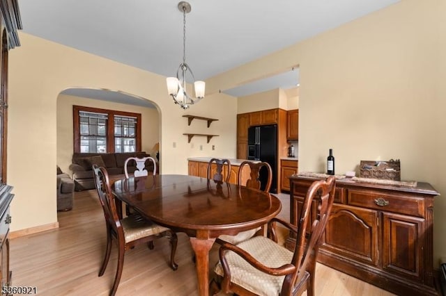 10 Garden Pl, Cranford Twp, NJ 07016 - dining space with arched walkways and light wood finished floors