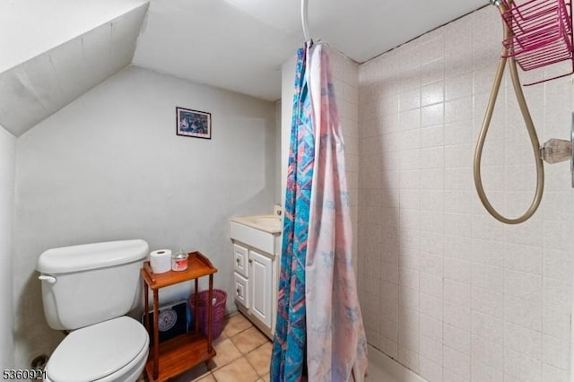 10 Garden Pl, Cranford Twp, NJ 07016 - bathroom featuring a tile shower, vanity, toilet, tile patterned flooring, and lofted ceiling