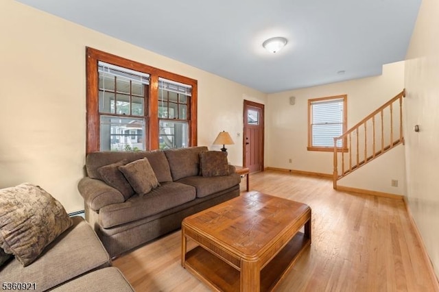 10 Garden Pl, Cranford Twp, NJ 07016 - living room featuring stairs, light wood-style floors, baseboards, and baseboard heating