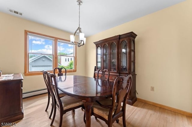 10 Garden Pl, Cranford Twp, NJ 07016 - dining area featuring a baseboard radiator, a chandelier, light wood-style floors, and baseboards