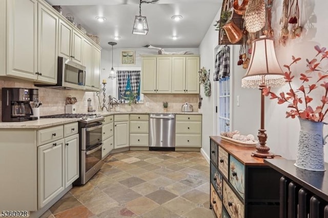 2 Broad St, Stockton Boro, NJ 08559 - kitchen featuring stainless steel appliances, tasteful backsplash, cream cabinets, and hanging light fixtures