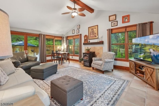 2 Broad St, Stockton Boro, NJ 08559 - living area featuring a ceiling fan, a wood stove, light tile patterned flooring, and baseboards