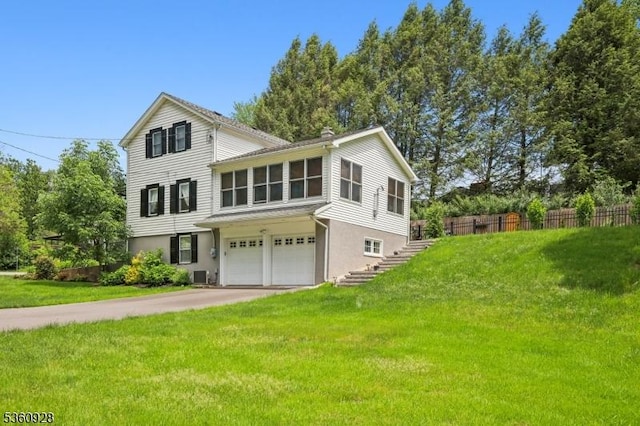 2 Broad St, Stockton Boro, NJ 08559 - view of front of house with a garage, asphalt driveway, stairway, stucco siding, and central AC