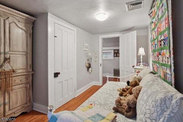 2 Broad St, Stockton Boro, NJ 08559 - bedroom with radiator heating unit, baseboards, and light wood-type flooring