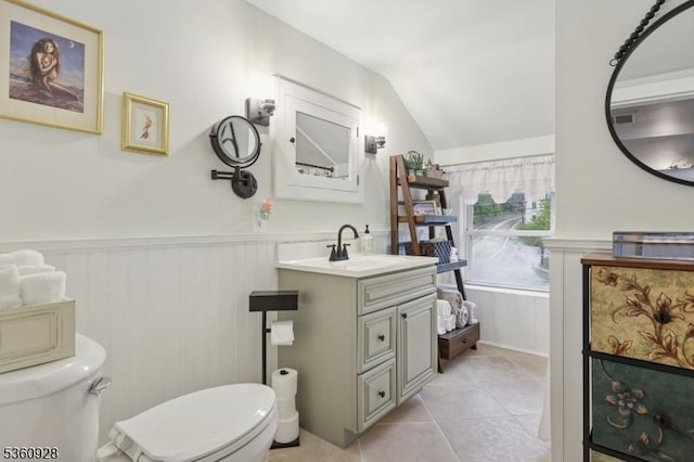 2 Broad St, Stockton Boro, NJ 08559 - bathroom featuring toilet, a wainscoted wall, vanity, tile patterned floors, and lofted ceiling
