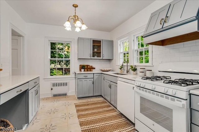 168 Grove St, Montclair Twp, NJ 07042 - kitchen featuring white appliances, radiator heating unit, gray cabinets, and a sink
