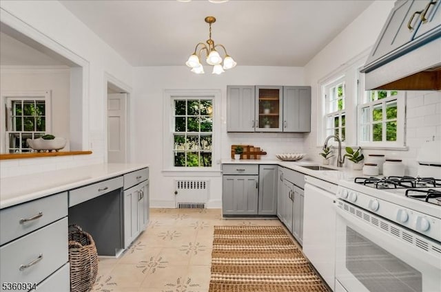 168 Grove St, Montclair Twp, NJ 07042 - kitchen featuring gray cabinets, white appliances, radiator heating unit, premium range hood, and tasteful backsplash