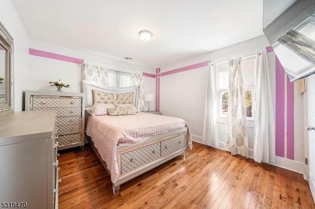 770 Stone St, Rahway City, NJ 07065 - bedroom with light wood-type flooring and baseboards