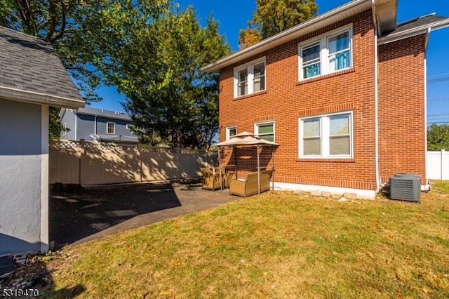 770 Stone St, Rahway City, NJ 07065 - back of house with brick siding, central AC, and a patio area